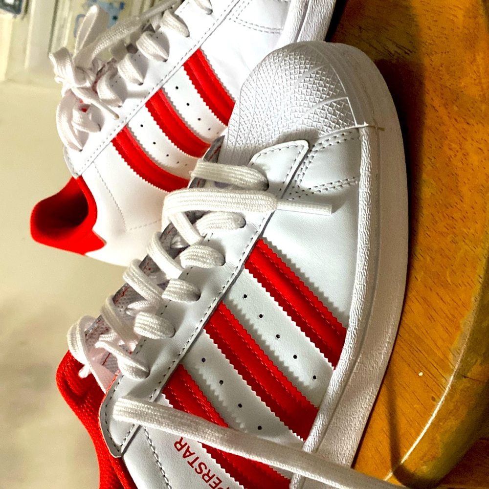 Boys adidas sneakers . Worn less than 10 times . No scuffs or marks